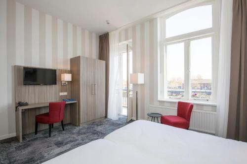 
Een bed of bedden in een kamer bij Fletcher Hotel-Restaurant Middelburg
