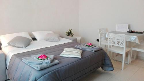 Postel nebo postele na pokoji v ubytování Residenze Principe Amedeo