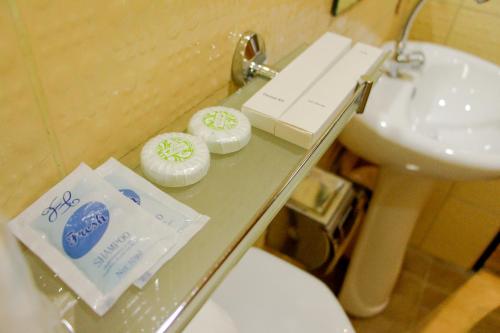 two donuts on a glass counter in a bathroom at Sulu Sea Boutique Hotel in Boracay