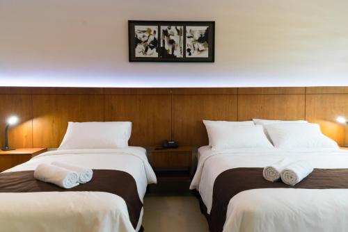 Postel nebo postele na pokoji v ubytování Hotel La Ría Durán