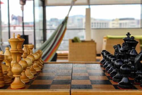 a chess board with chess pieces on top of it at Casa Q in Quito