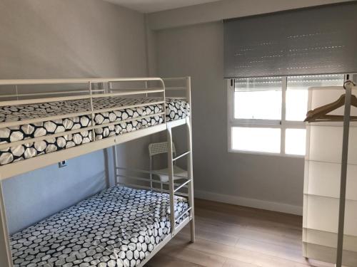 Postel nebo postele na pokoji v ubytování Apartments Campello