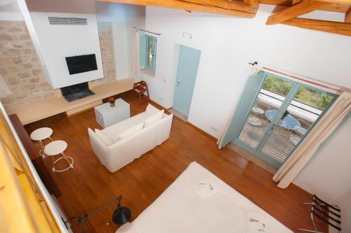 an overhead view of a living room with a couch at Lithos Guesthouse Kardamili in Kardamili