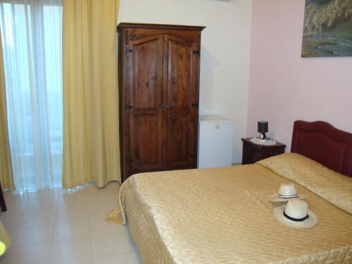 Ένα ή περισσότερα κρεβάτια σε δωμάτιο στο Bed & Breakfast Delle Palme