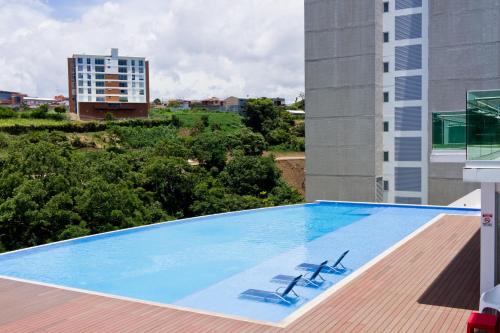 a swimming pool on the roof of a building at Modern 3 Bedroom Apartment in San José