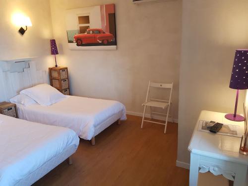 Katil atau katil-katil dalam bilik di Hôtel Le Niobel - Hôtel de Charme