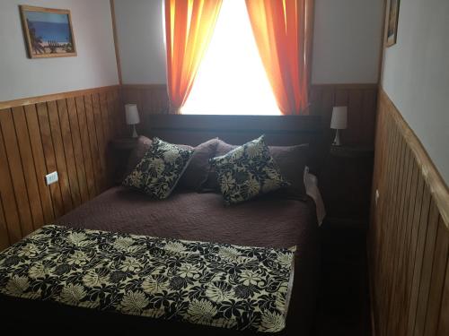 Una cama o camas en una habitación de Cabañas Henua Iti