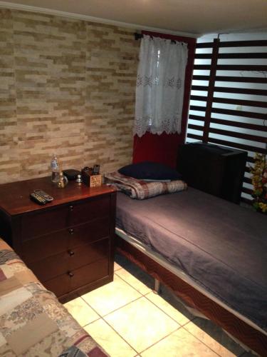 Кровать или кровати в номере Residencia familiar