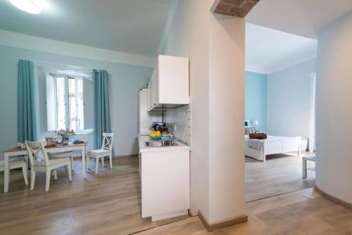 a living room with a kitchen and a dining room at B&B Umberto in Vietri sul Mare