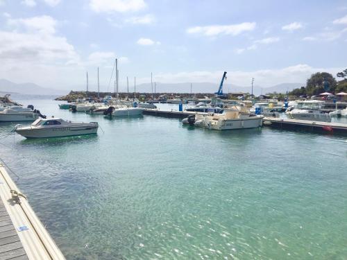 a group of boats docked in a marina at Les Villas MarInCelu in Porto Pollo