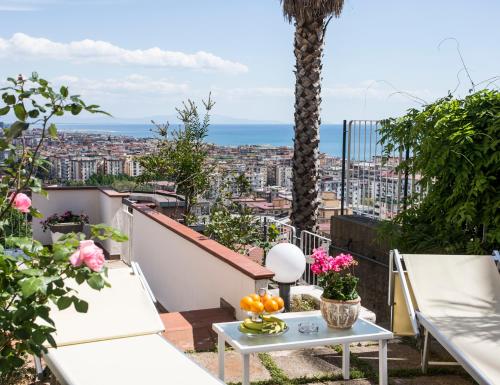 a balcony with a view of a city at Le ginestre di Titina - casa vacanza in Salerno