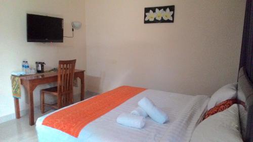 Cama ou camas em um quarto em Griya Bun Sari