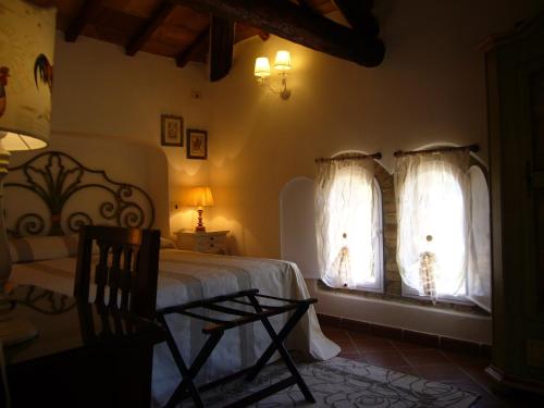 Cama o camas de una habitación en Mulino Di Quercegrossa