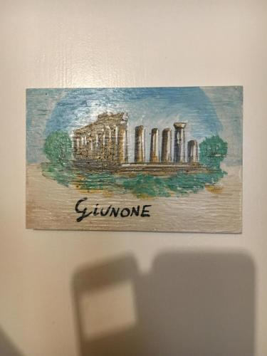 a painting of a building on a wall at La Città degli Dei in Agrigento