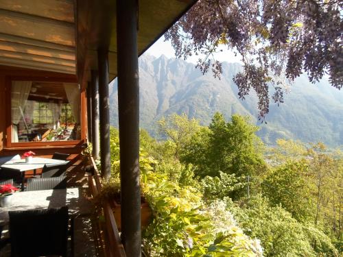 a balcony of a house with a view of the mountains at Antica Trattoria del Boden in Ornavasso