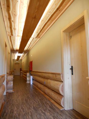 an empty hallway of a building with wooden walls at Penzion U Fábů in Lednice