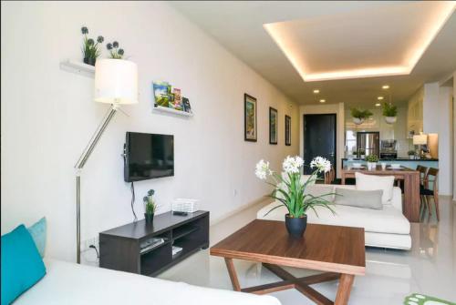 a living room with a couch and a table at Relax & Chill at Malacca River in Melaka