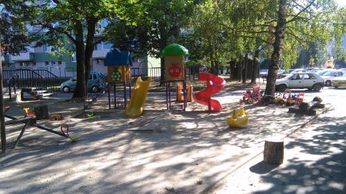 a playground with a slide in a park at Penzion V Ráji in Strakonice