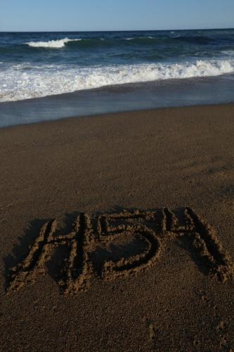 a word written in the sand on the beach at Hotel 54 Barceloneta in Barcelona