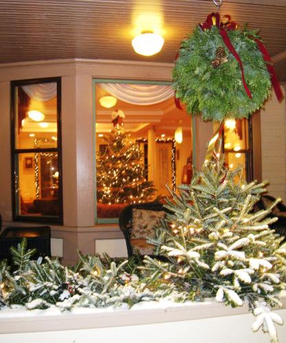 a group of christmas trees in a living room at The Wentworth in Jackson