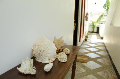 a table with shells sitting on top of it at Sulu Sea Boutique Hotel in Boracay