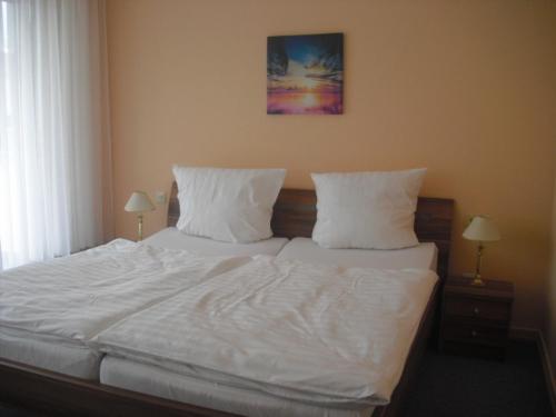 Postel nebo postele na pokoji v ubytování Hotel Feilen-Wolff
