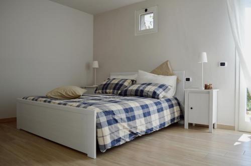 Posteľ alebo postele v izbe v ubytovaní Locazione turistica Casa olivo
