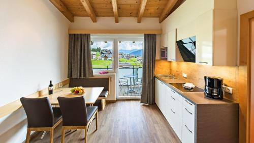 Kuchyň nebo kuchyňský kout v ubytování Apart-Hotel Bergkönig