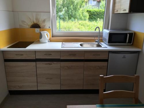 Kuchyň nebo kuchyňský kout v ubytování Niebieskie Migdały