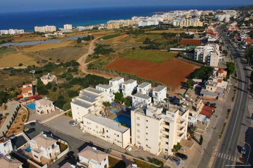 an aerial view of a city with white buildings and the ocean at Sweet Memories Hotel Apts in Protaras