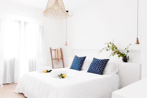 A bed or beds in a room at Principe Di Salina Boutique Hotel