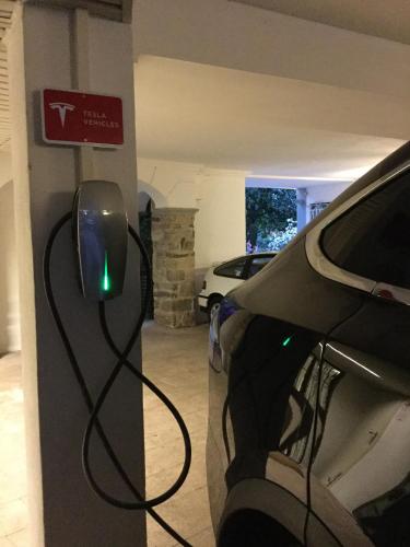 a car parked in a garage with a computer mouse at Hotel Royal in Stresa