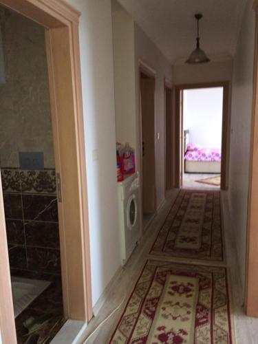 a hallway of a house with a laundry room at Menekşe Apart 2 in Trabzon