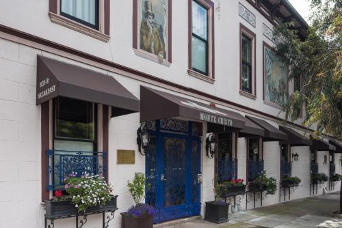 a building with a blue door on a street at Monte Cristo Bed and Breakfast in San Francisco