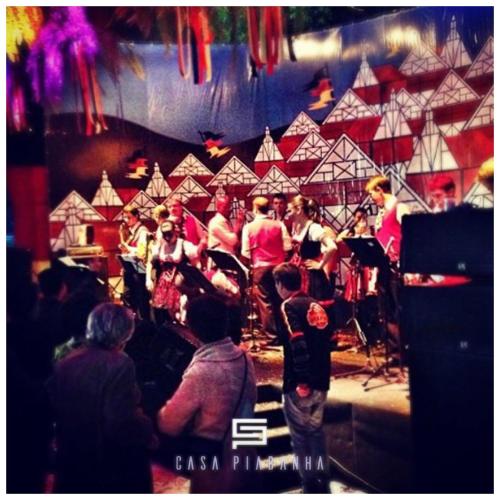 a group of people on a stage with a orchestra at Casa Piabanha - Centro Histórico in Petrópolis