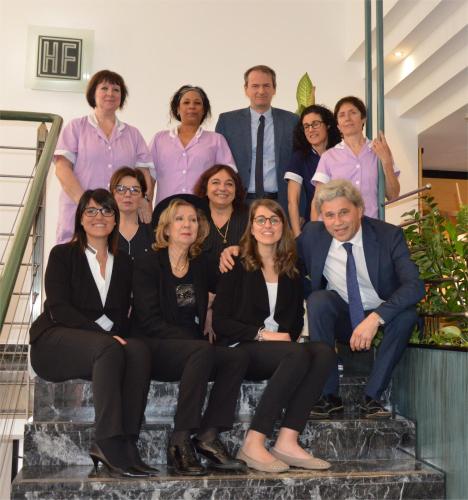 a group of people sitting on the stairs at Hotel Friuli in Udine