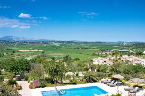 an aerial view of a resort with a swimming pool at Casa Font i Roig in Maria de la Salut