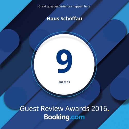 a flyer for a guest review awards with a white circle at Haus Schöffau in Strobl