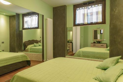 Postelja oz. postelje v sobi nastanitve Appartamenti Luxury Arco