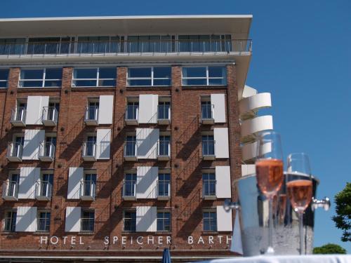 a hotel with a building in the background at Speicher Barth - Superior-Hotel in Barth