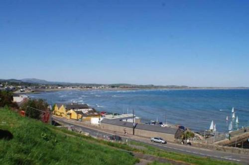 a view of a body of water with a road at Coastguard Cottage in Newcastle