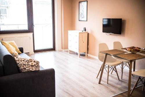 Μια τηλεόραση ή/και κέντρο ψυχαγωγίας στο Apartamenty Opal