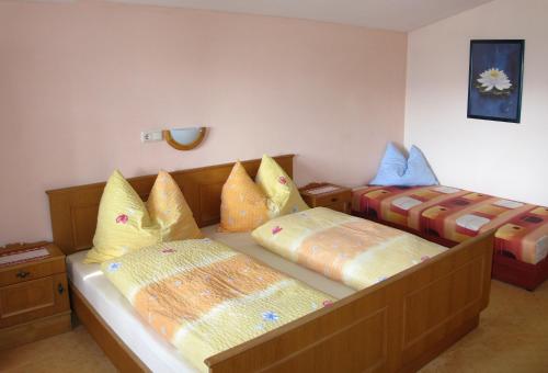 a bedroom with two beds with pillows on it at Haus Jochblick Familie Loinger in Itter