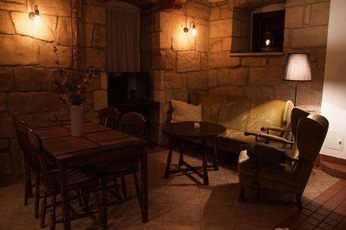 a living room with a couch and a table at Siedem Łanów in Wünschelburg