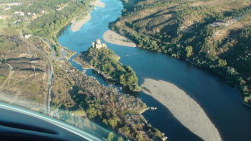an aerial view of a river with a castle at Quinta das Arribas in Abrantes