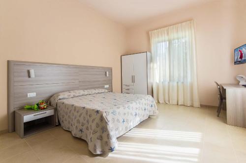Ένα ή περισσότερα κρεβάτια σε δωμάτιο στο Hotel Villa San Giuseppe
