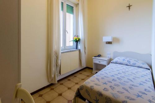 Ένα ή περισσότερα κρεβάτια σε δωμάτιο στο Hotel Villa San Giuseppe