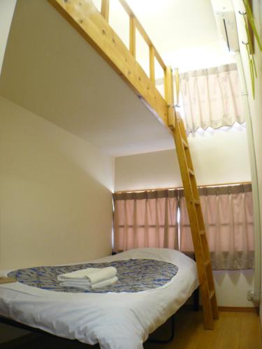 Voodi või voodid majutusasutuse Hotel Meigetsu toas