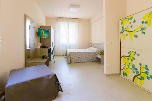 Ένα ή περισσότερα κρεβάτια σε δωμάτιο στο Hotel Villa San Giuseppe