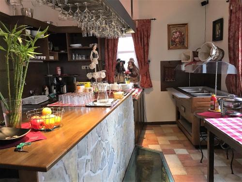 a kitchen with a counter top in a room at Penzión Villa Mon Ami in Smokovce